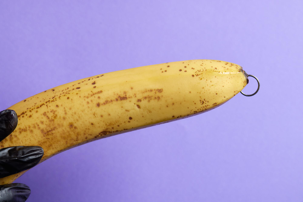 banana with piercing decoration minimal piercing concept